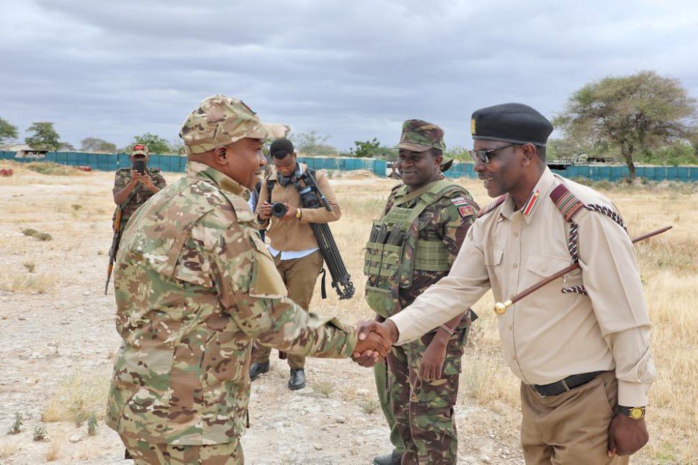 Interior cs Kithure Kindiki is received by security officers in Mandera.COURTESY