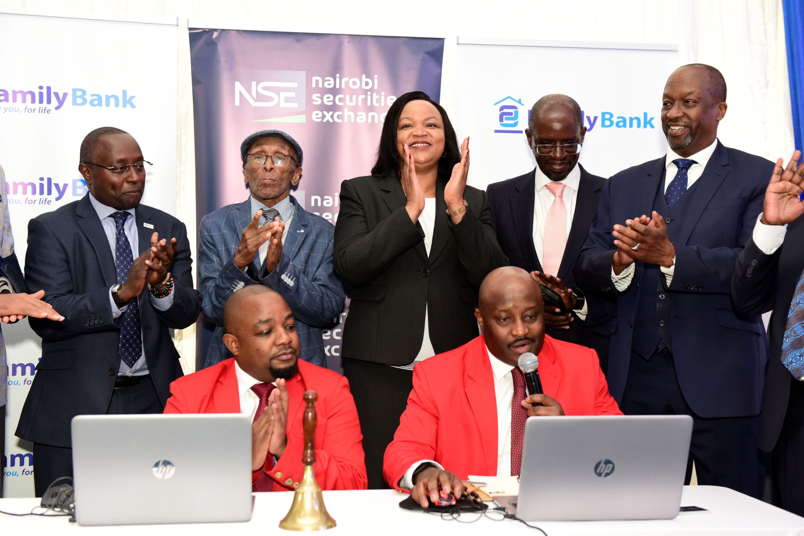 NSE CEO Frank Mwiti, Family Bank Founder T.K. Muya, CEO Nancy Njau, CBK Chair Andrew Musangi & NSE Chair Kiprono Kittony join Brian Mutunga & Tony Waweru during the listing of the bank’s shares on NSE by way of introduction where the shares opened trading at Ksh.22.58 per share above the introductory price of KSh 18.00.