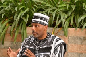 Activist Ayo Kimathi speaking in Nairobi about concerns over the US Global Health Strategy in Africa.