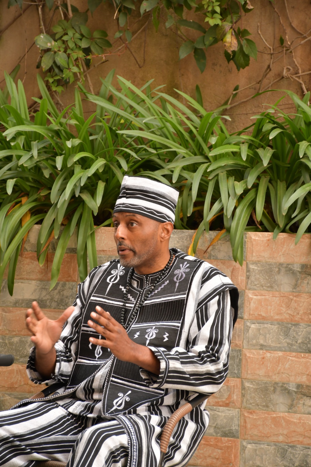 Activist Ayo Kimathi speaking in Nairobi about concerns over the US Global Health Strategy in Africa.